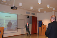 Norwegian State Secretary Mr Espen Barth Eide (left) is addressed by SC 116 Course Member Cdr Altmeier during the Q&A session.