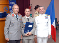 Senior Course 116 President, Col Yves-Marie AUBRY (FRA A, center), holding his graduation diploma, with Admiral Giampaolo DI PAOLA (right) and Lt Gen Wolf-Dieter LOESER (left)

