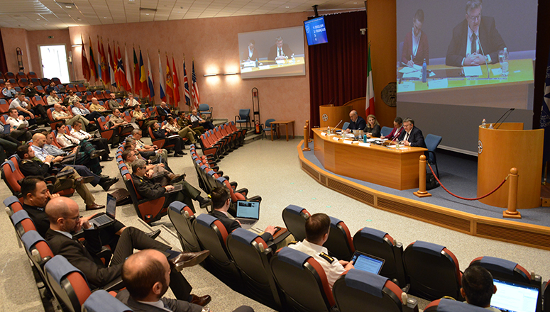 Senior Course 143 during the Middle East Seminar - first day of lectures in the Main Auditorium. Panel (from left to right) Dr Pedde, panel moderator Mrs Vellone, Dr Colombo and Dr Razoux