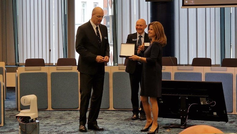 Ms PEIL receiving an NDC plaque from BGEN LEITGEN