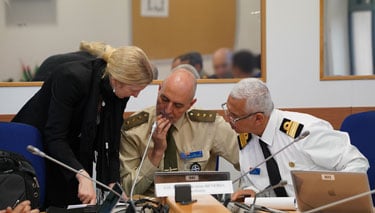 Course Members working together in their Committee rooms on the Strategy Challenge simulation 