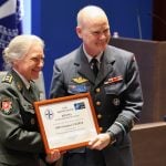 NDC Commandant LGEN Nielsen awards MGEN Seewer the Distinguished Ancien diploma